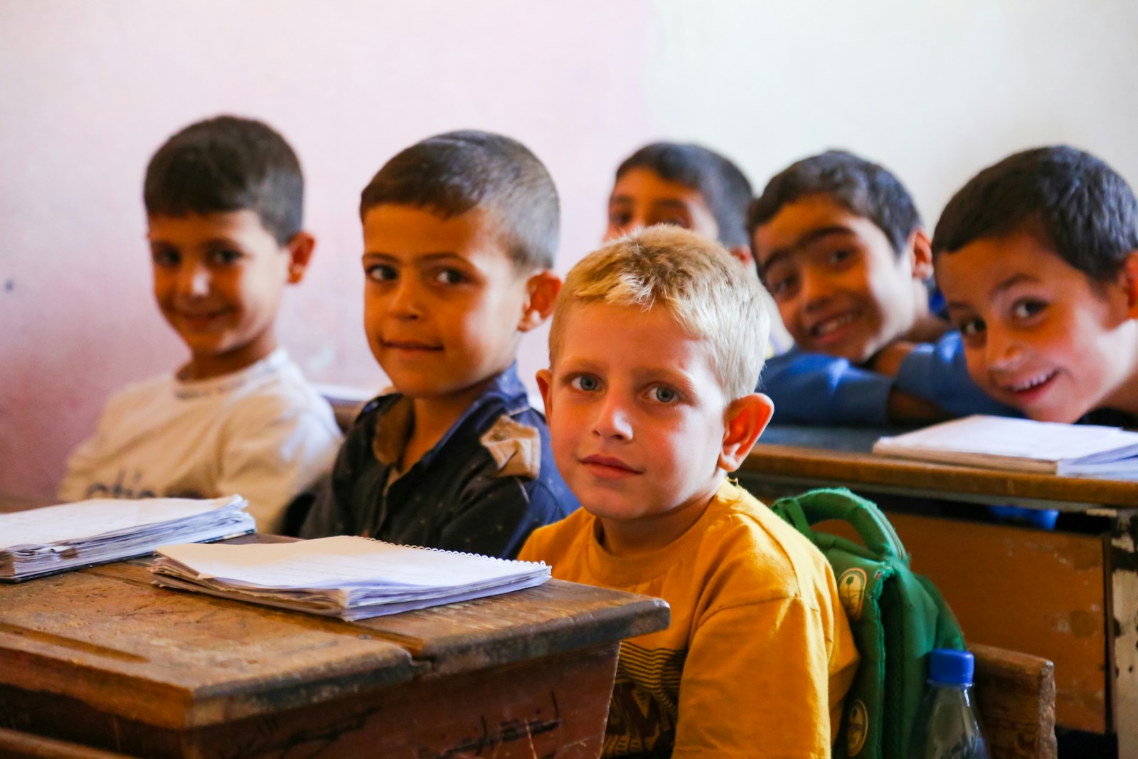 A group of children sitting at desks in a classroom